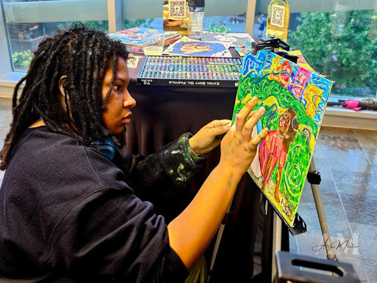15 year old, Charlotte-based visual artist, Marley White blends a painting during a Live Painting session at Harvey B. Gantt Center.