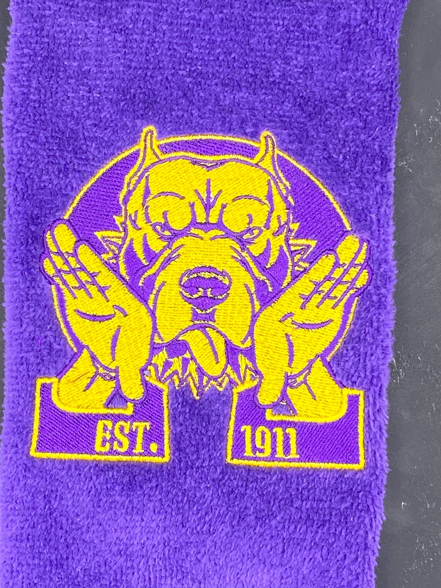 Omega Psi Phi Hooks Towel stitched on a purple velour plush towel