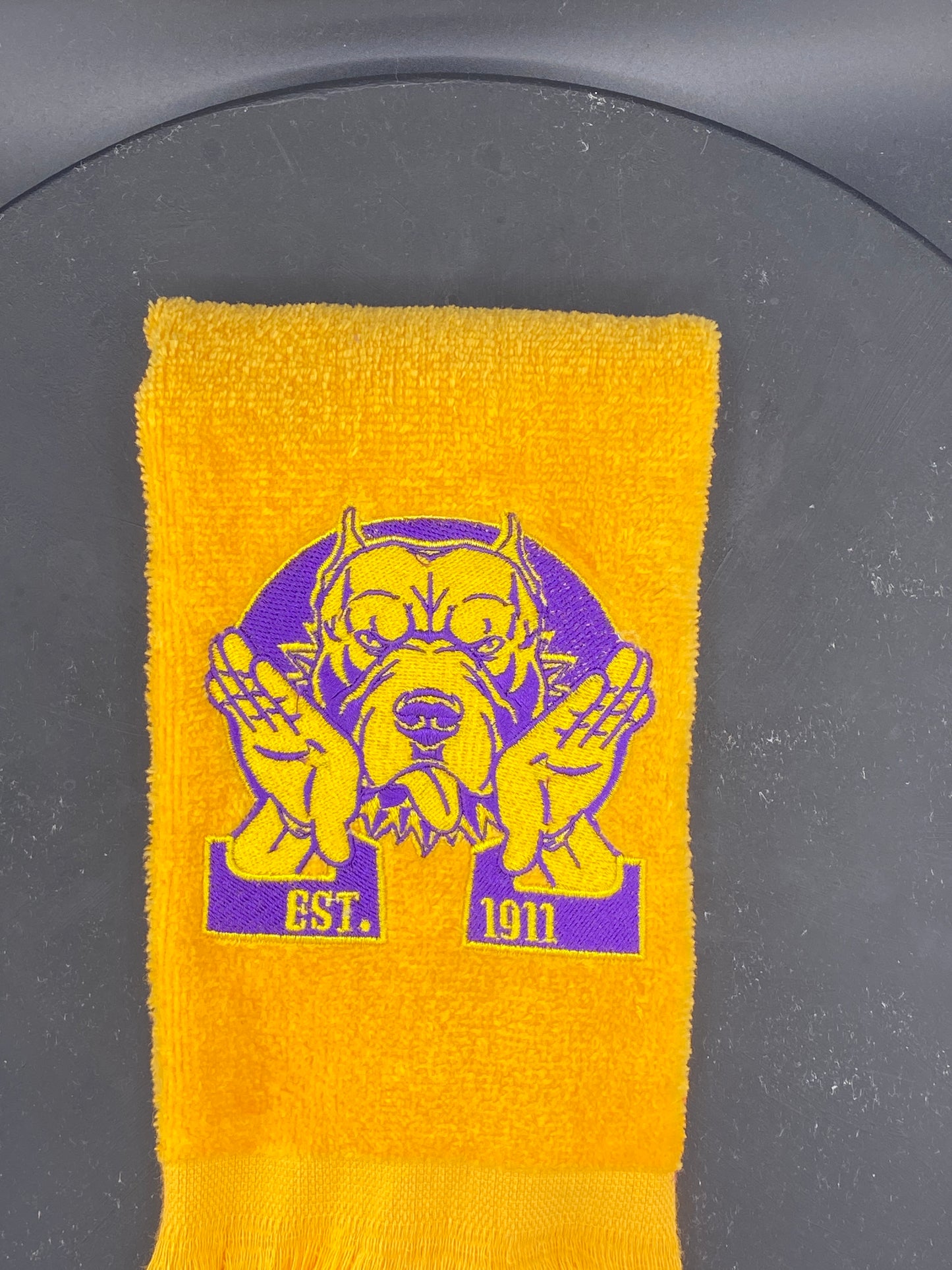 Omega Psi Phi Hooks Towel stitched on a gold velour plush towel