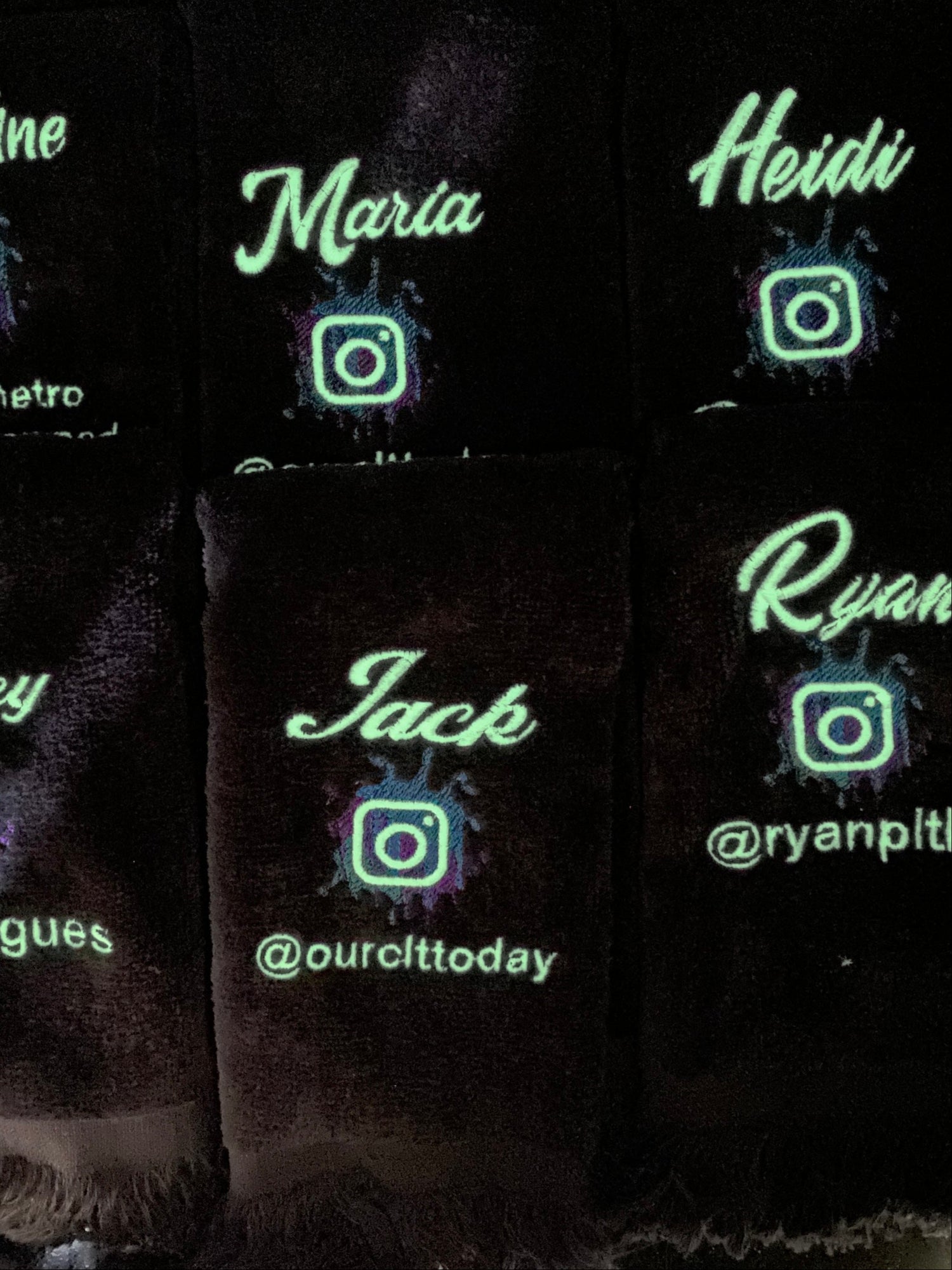 6 black velour fringed fingertip towels embroidered with the first name and instagram account of Charlotte's local media personel.