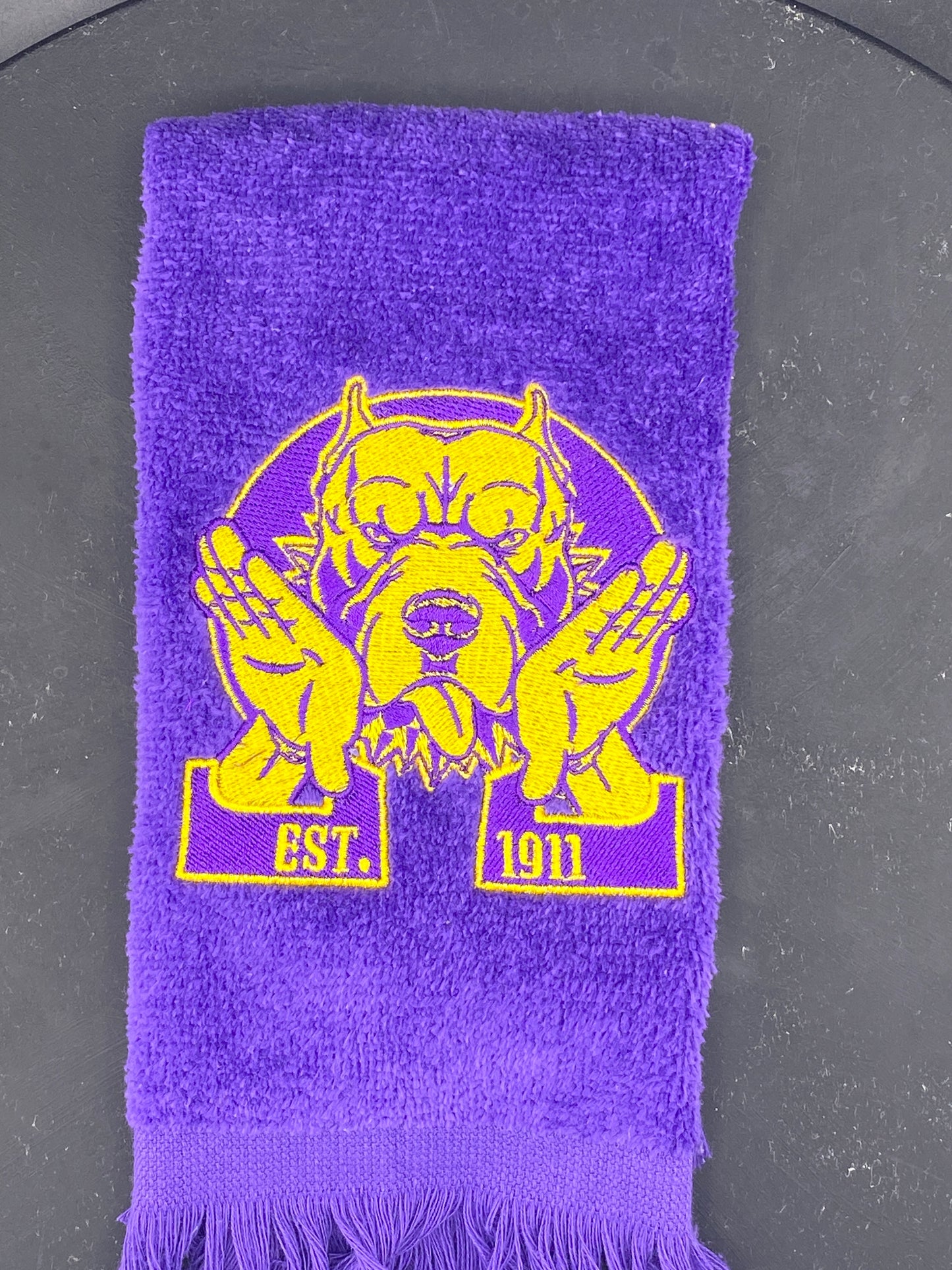Omega Psi Phi Hooks Towel stitched on a purple velour plush towel