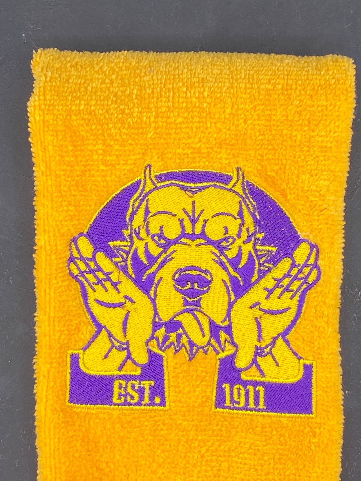 Omega Psi Phi Hooks Towel stitched on a gold velour plush towel