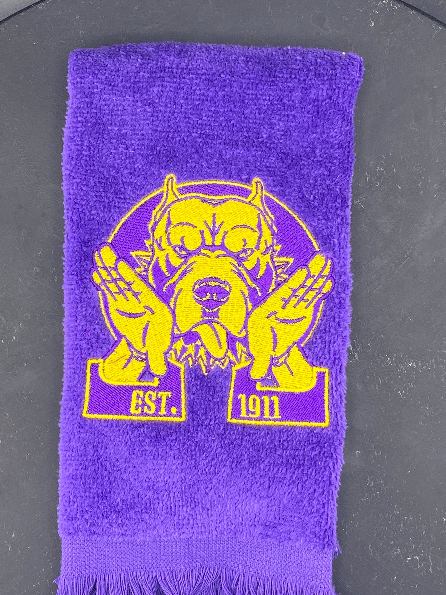 Omega Psi Phi Hooks Towel stitched on a purple velour plush towel