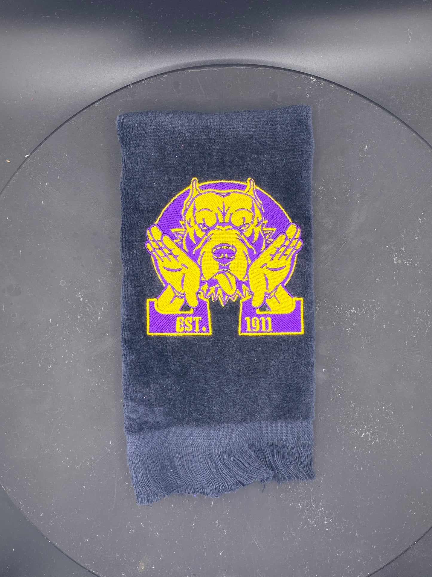 Omega Psi Phi Hooks Towel stitched on a black velour plush towel