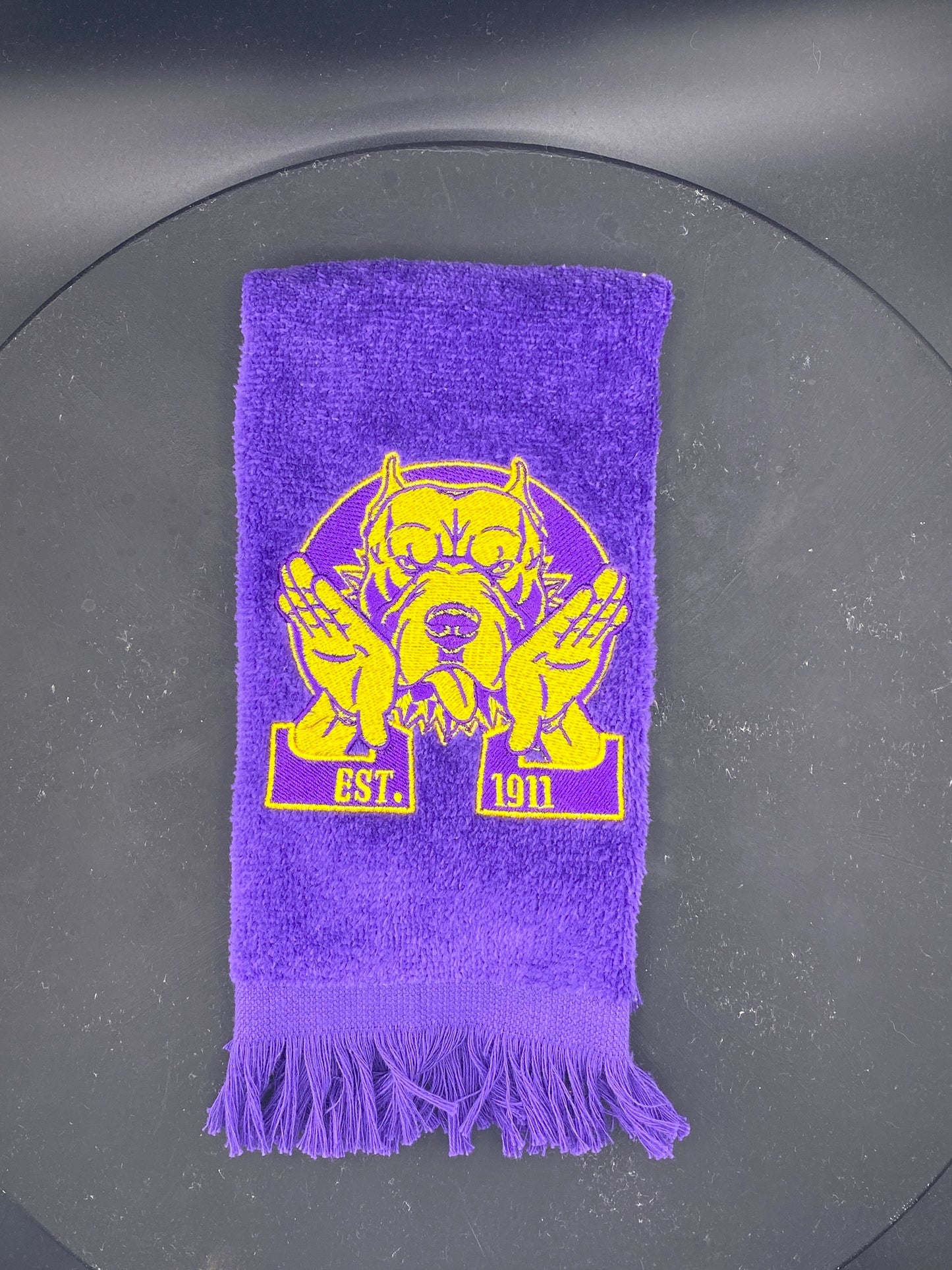 Omega Psi Phi Hooks Towel stitched on a purple velour plush towel