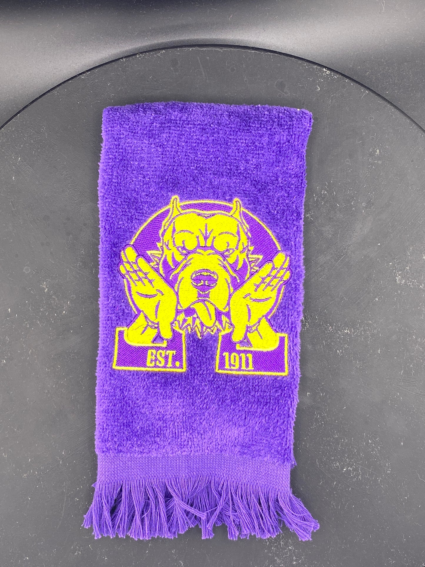 Omega Psi Phi Hooks Towel stitched on a purple velour plush towel
