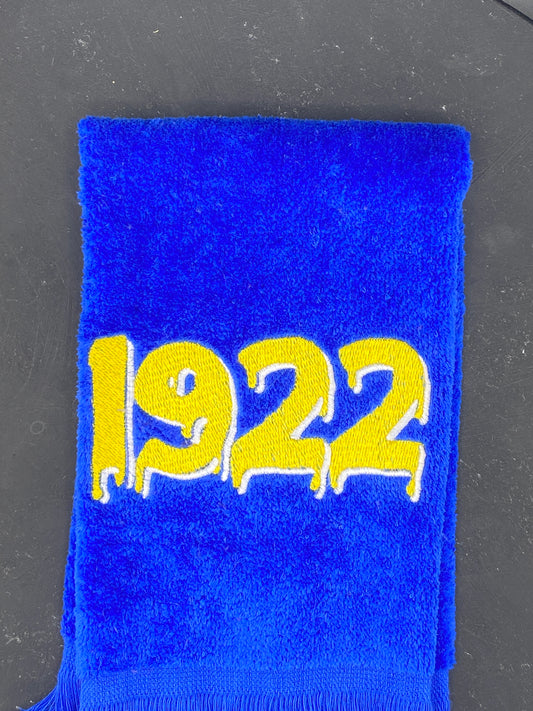 Royal Blue velour towel embroidered with a dripping 1922 in gold and white.