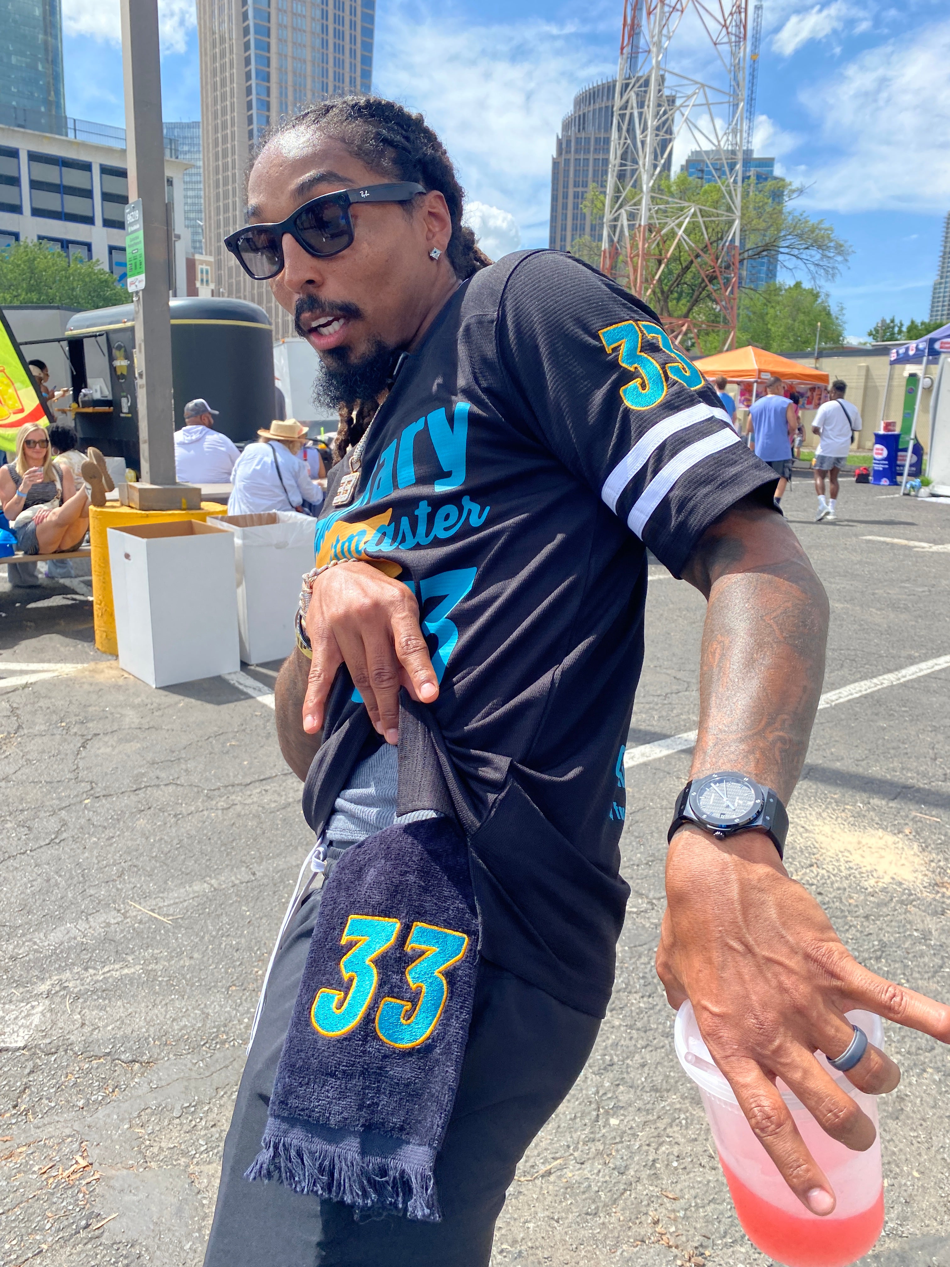 Carolina Panther's Tre Boston sports his custom Leisure Luxe Towel embroidered with his number 33. The towel matches his custom football jersey both made by West & Remount Custom Apparel.