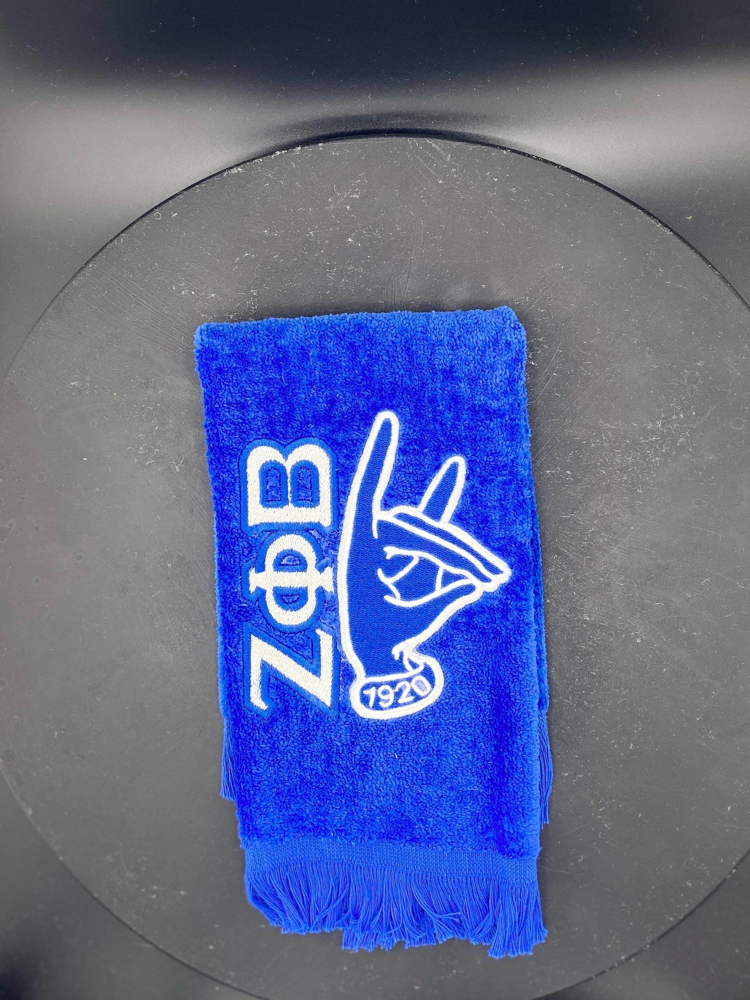 Zeta Phi Beta stroll towel on royal blue velour. Design features the letters, 1920 and the Kitty hand sign. 