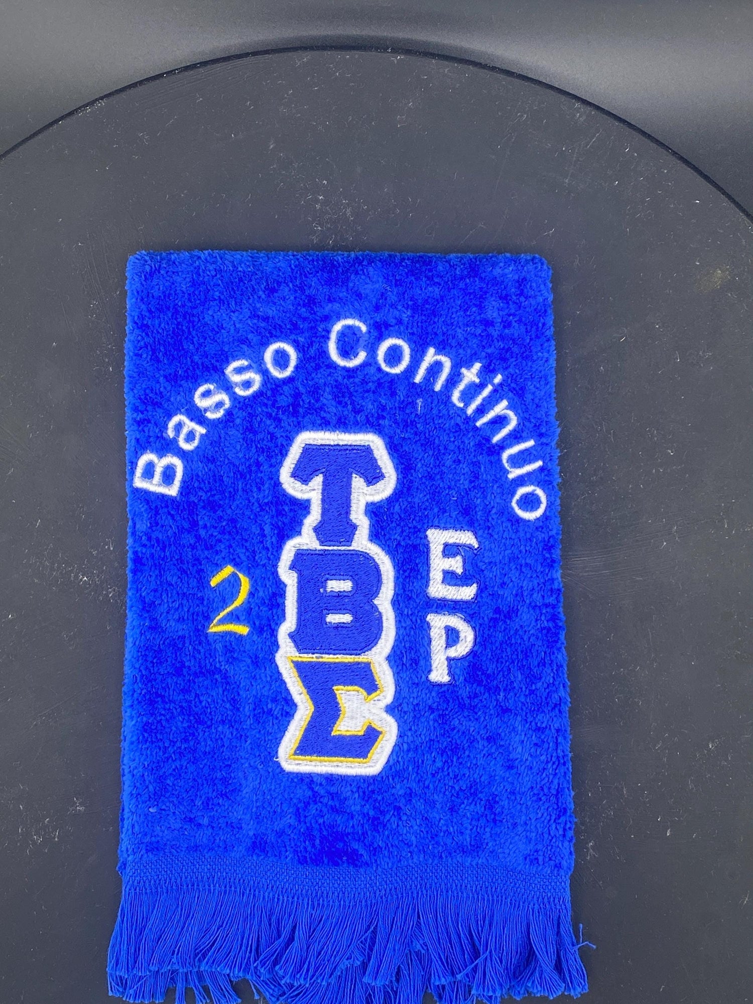 Tau Beta Sigma personalized velour Stroll Towel in Royal blue, white, and a gold accent. 