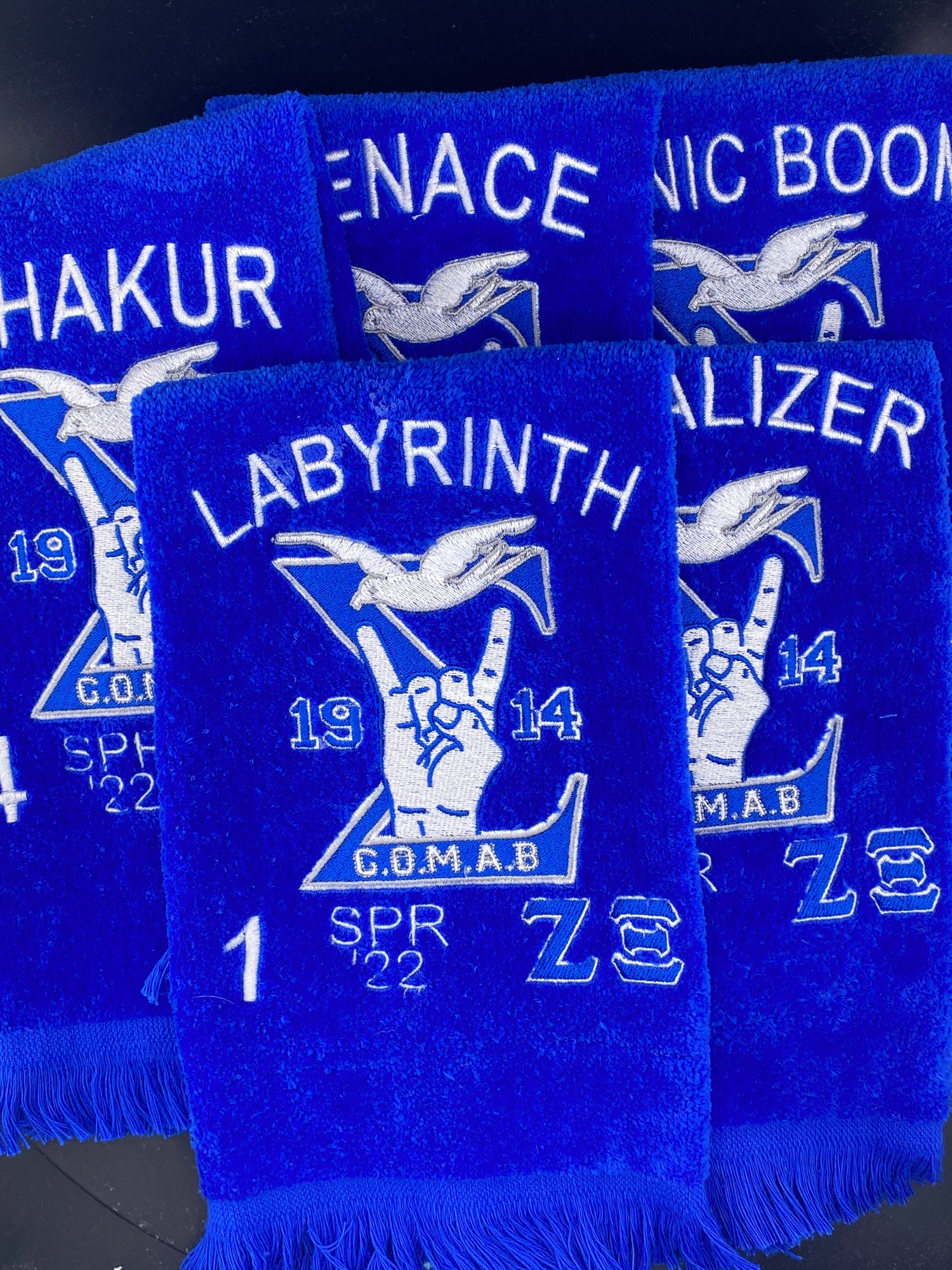 5 Royal Blue Velour GOMAB Stroll Towels embroidered with the Zeta Xi Chapter Lines names, numbers, and year of crossing. 