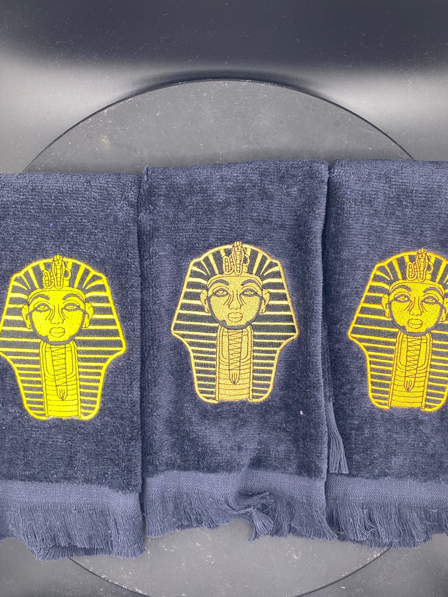 3 Alpha Phi Alpha Sphinx Stroll Towels stitched in Yellow Gold, Satin Gold, and Old Gold