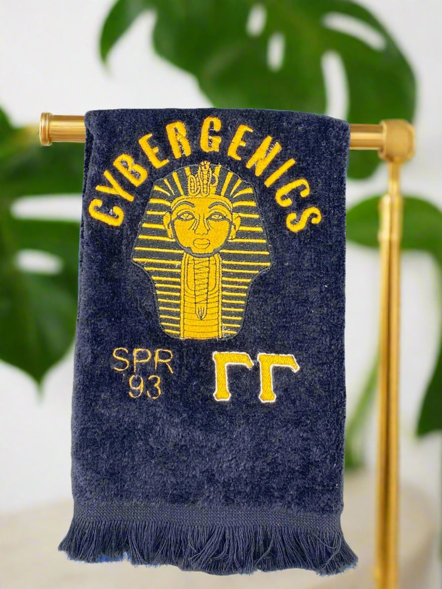 Custom Alpha Phi Alpha Sphinx Stroll towel with gold embroidery, featuring the Line name, fraternity’s symbol, and chapter on a black velour fingertip towel. Perfect for Greek events, strolls, and Divine 9 reunions.
