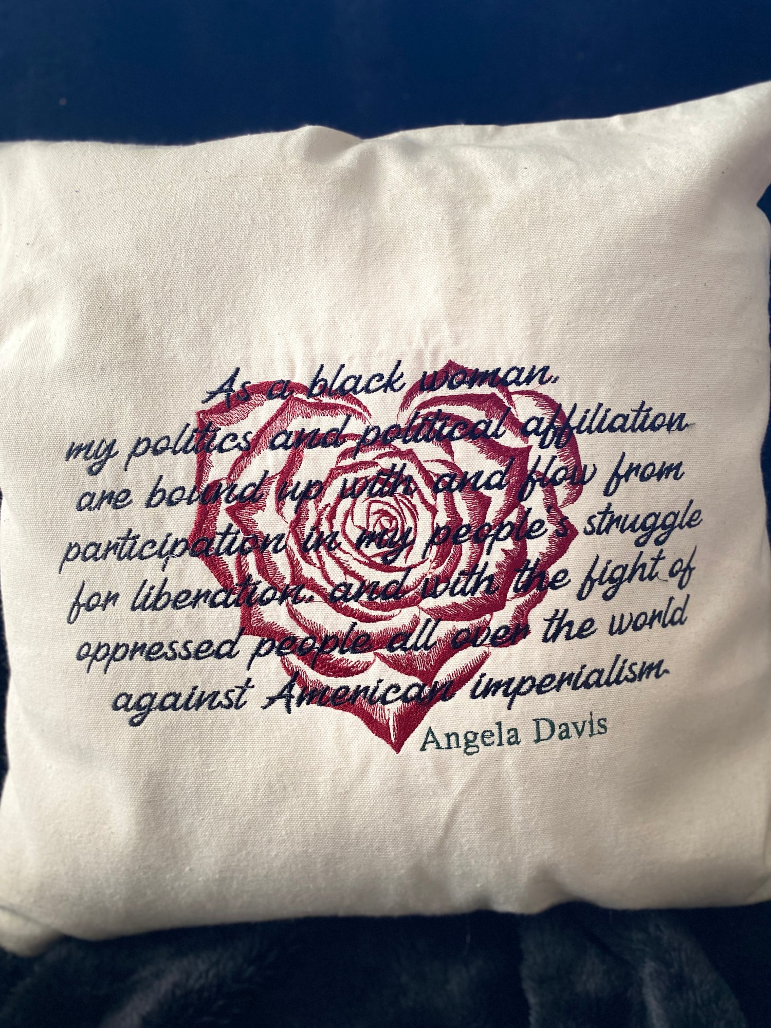 "As a black woman, my politics and political affiliation are bound up with and flow from participation in my people's struggle for liberation, and with the fight of oppressed people all over the world against American imperialism." embroidered on a natural cotton zippered pillow cover