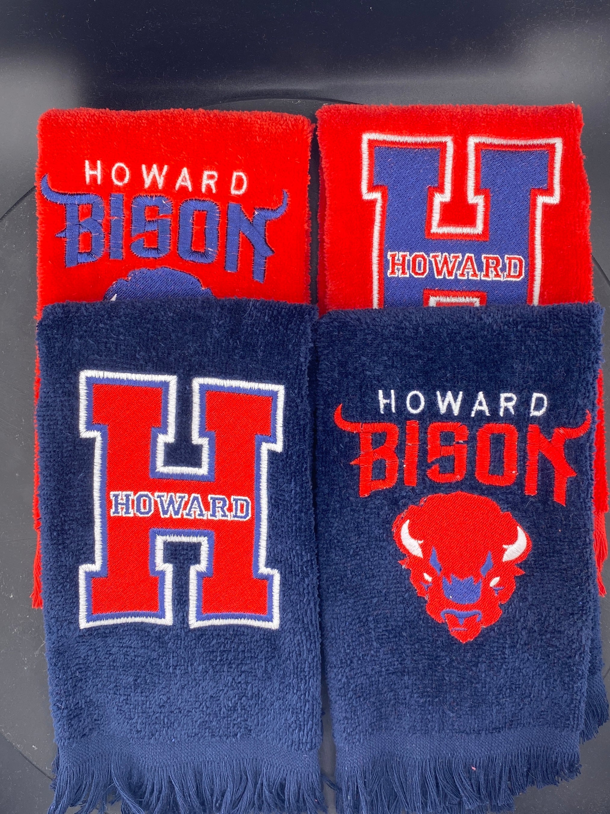 2 red and 2 navy towels embroidered with Howard Bison, and the Iconic H logo. 