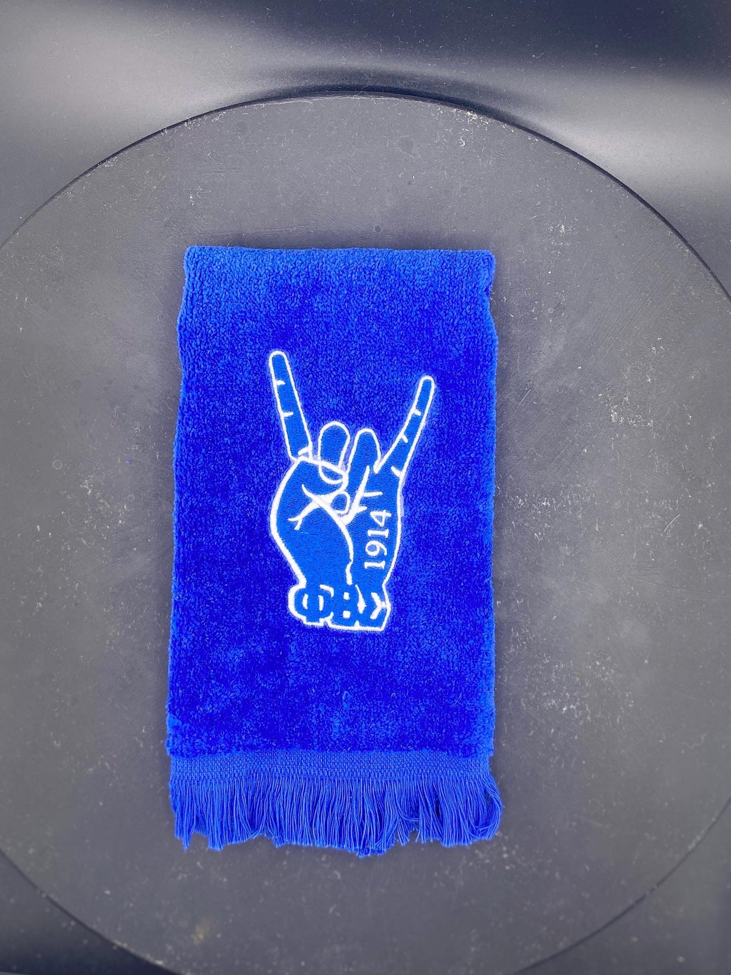 Phi Beta Sigma Hand Stroll Towel on royal blue features 1914 and letters. 