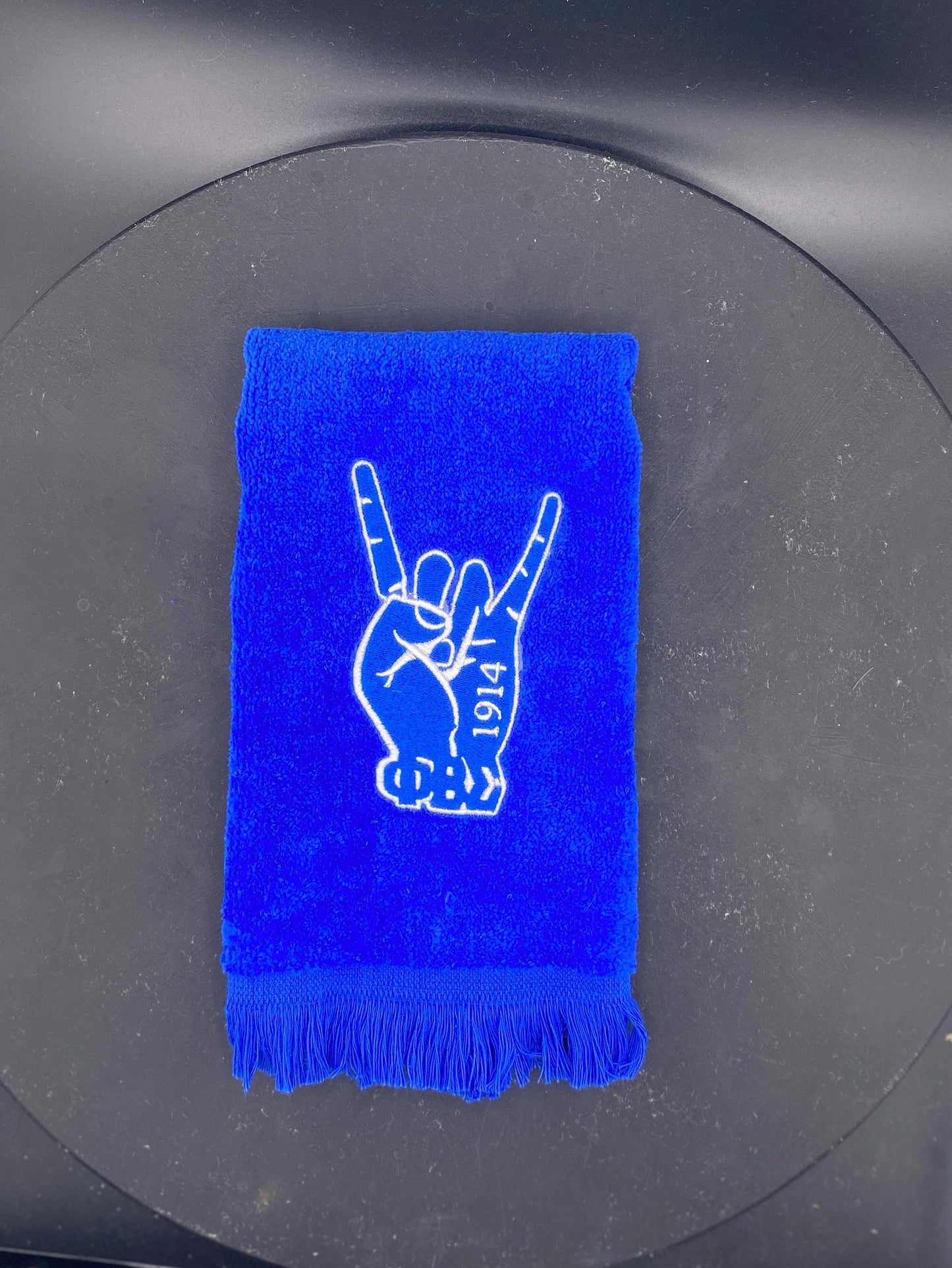 Phi Beta Sigma Hand Stroll Towel on royal blue features 1914 and letters. 