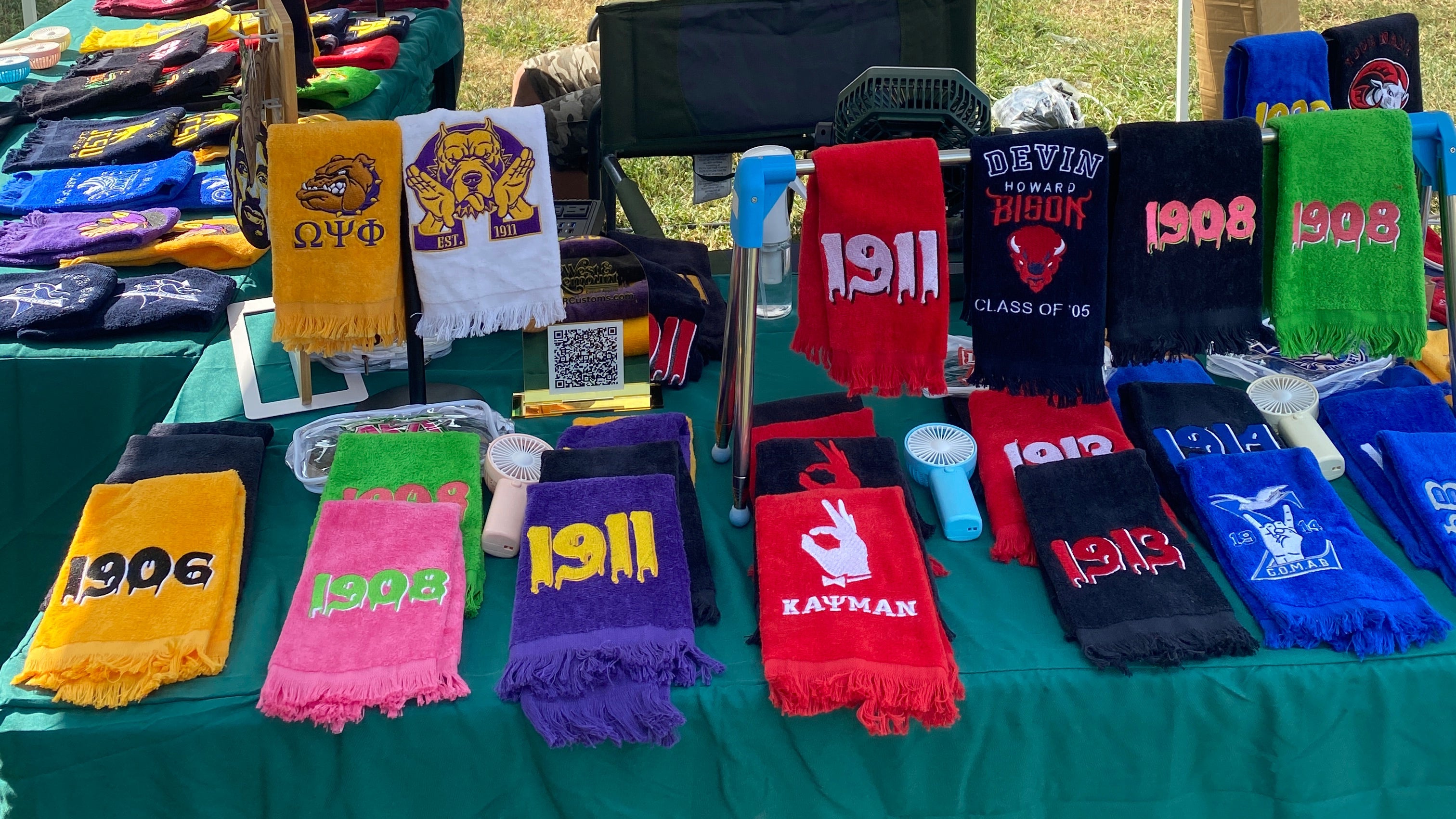 Marley sitting at the West & Remount table at the 2025 Queen City HBCU Cookout. 