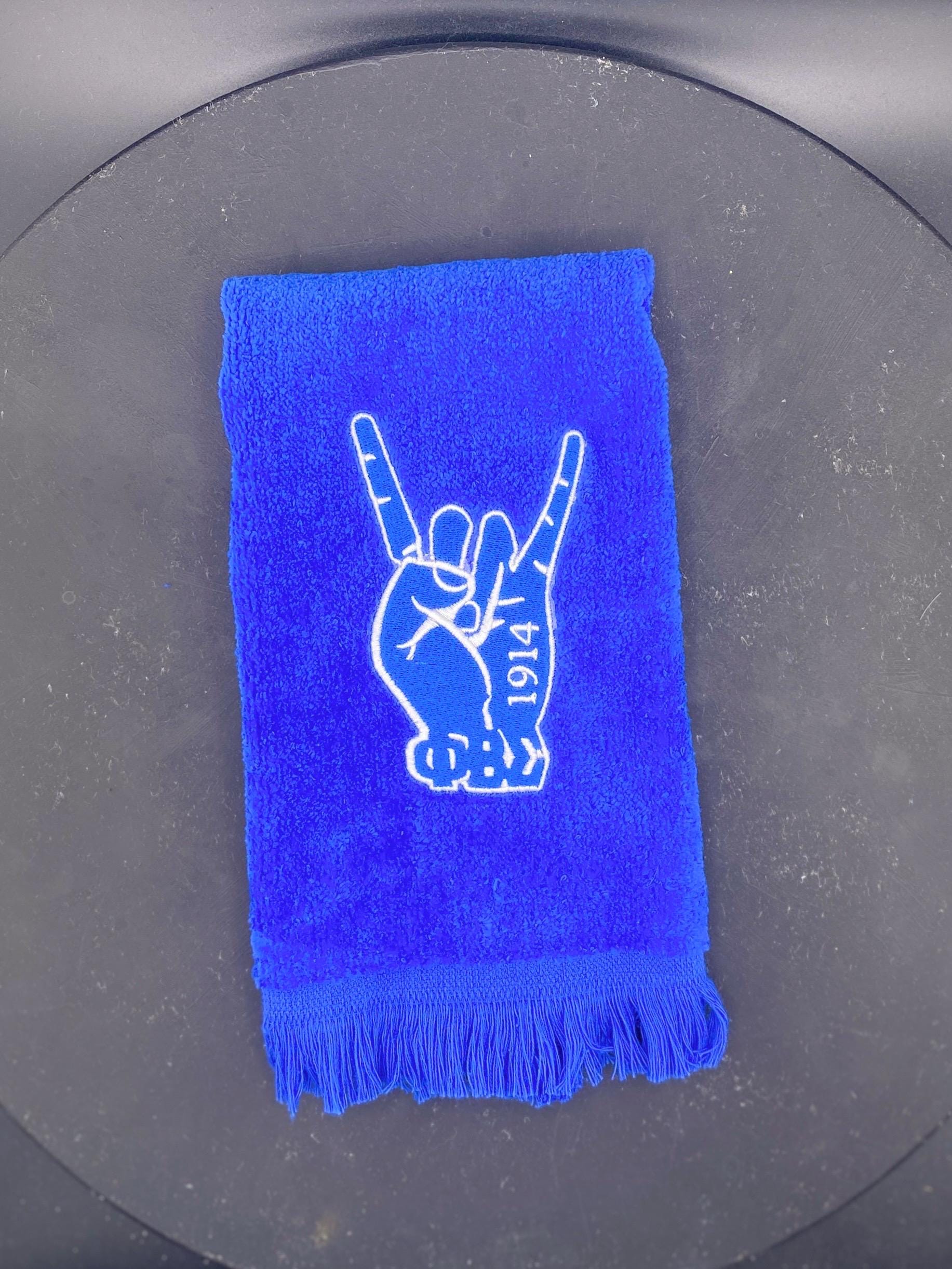Phi Beta Sigma Hand Stroll Towel on royal blue features 1914 and letters. 