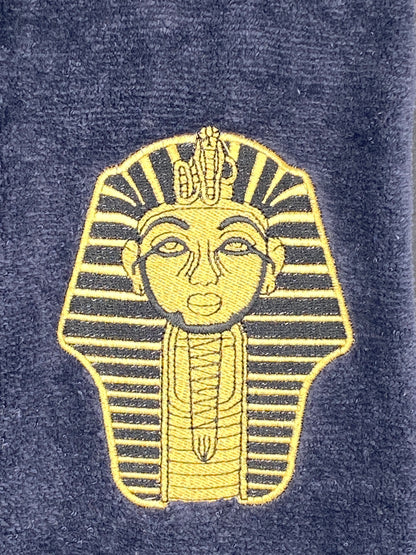 A closeup view of the embroidered Satin Gold Sphinx on our Alpha Phi Alpha Sphinx Stroll Towel
