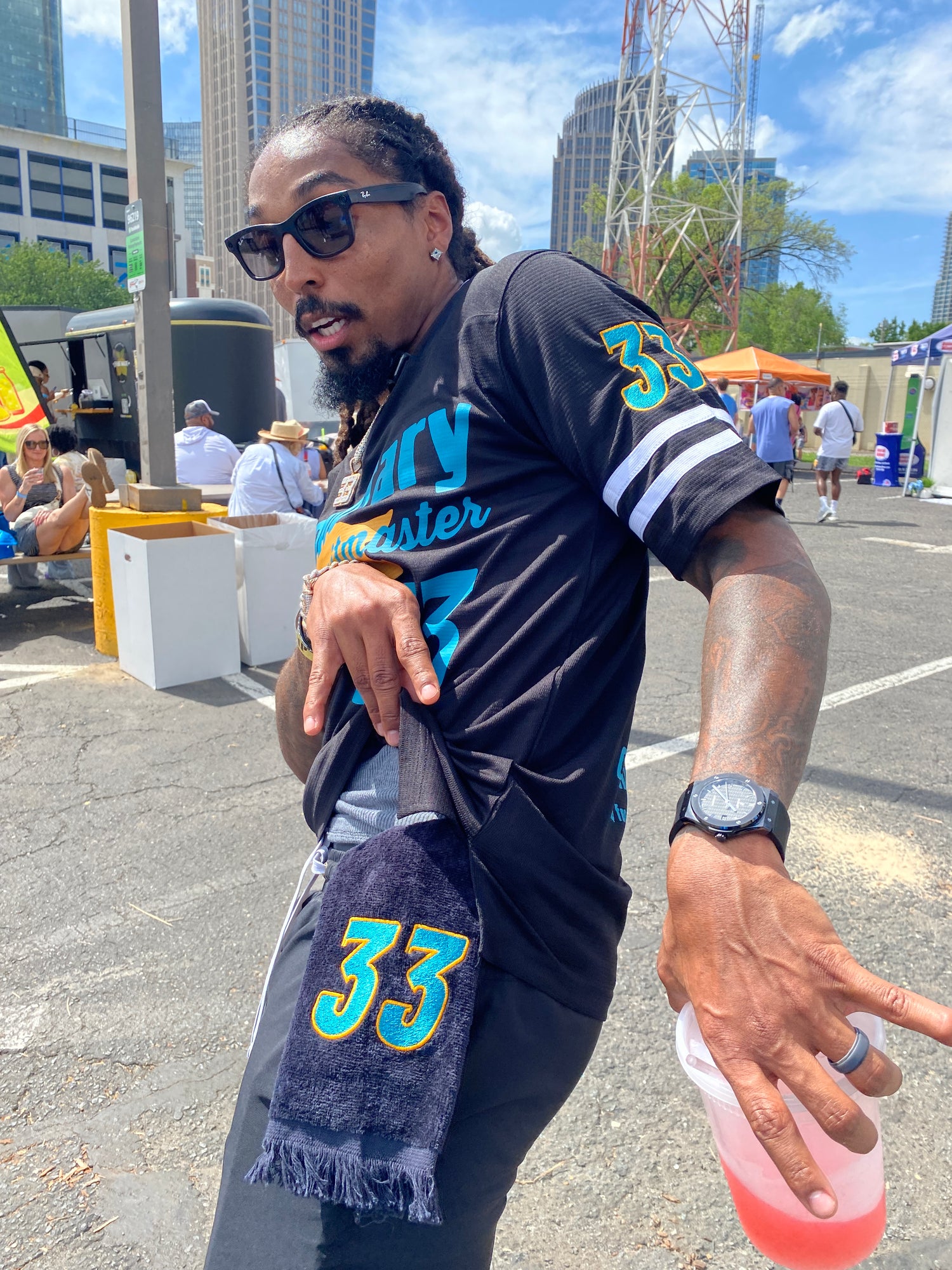 Carolina Panther's Tre Boston sports his custom Leisure Luxe Towel embroidered with his number 33. The towel matches his custom football jersey both made by West & Remount Custom Apparel. 