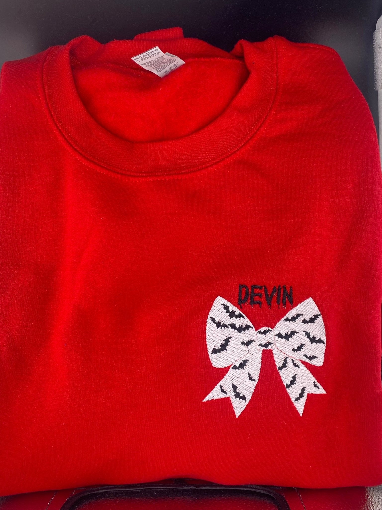 Bat Bow Halloween Sweatshirt in Red – Optional Dripping Name Personalization - West & Remount Custom Apparel