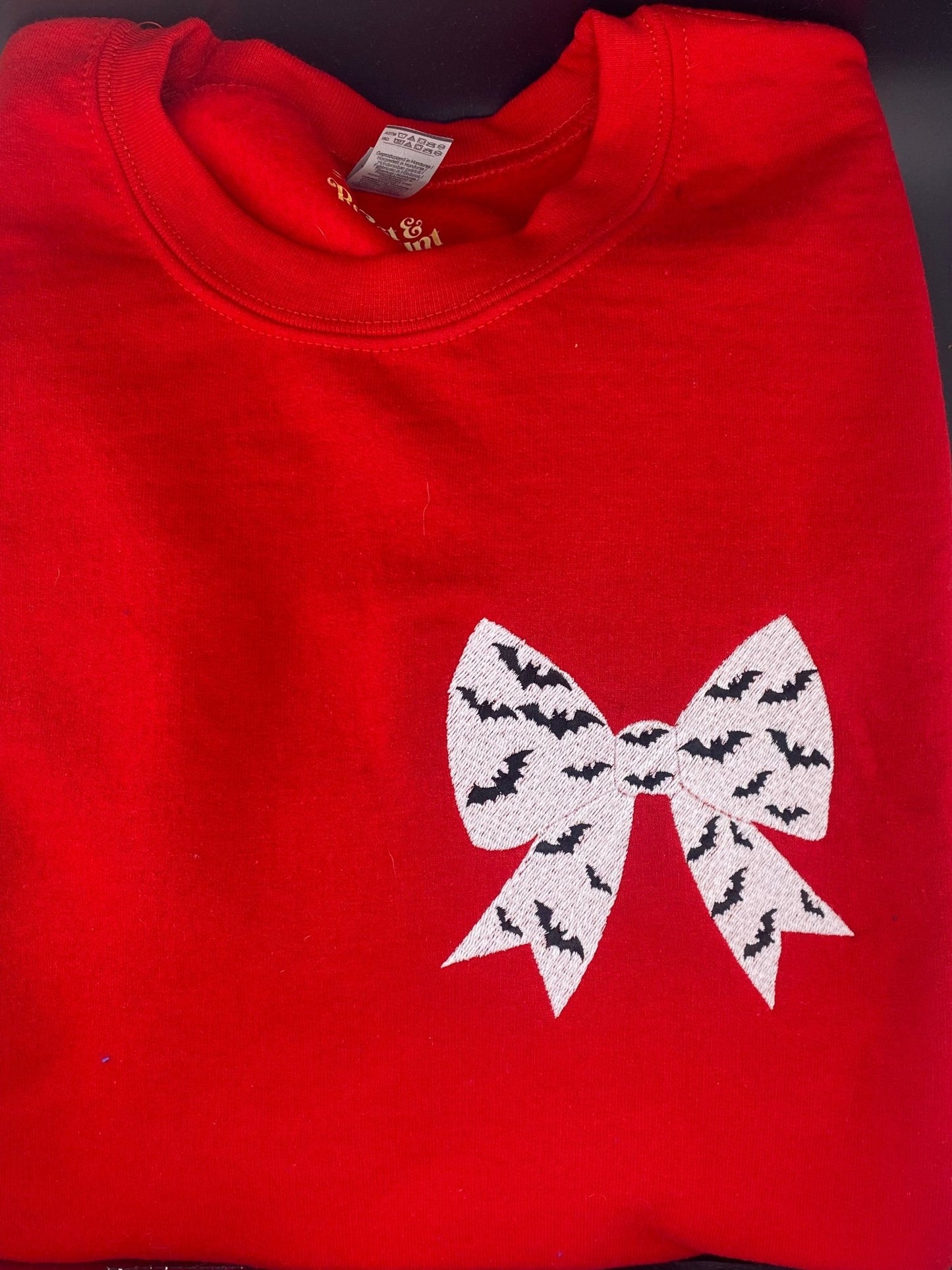 Bat Bow Halloween Sweatshirt in Red – Optional Dripping Name Personalization - West & Remount Custom Apparel