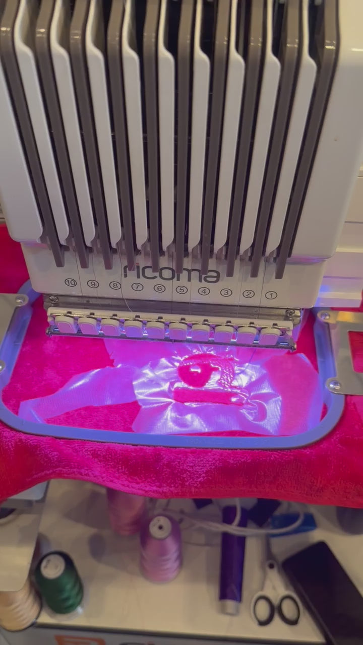 Load video: Live Personalization Embroidery at the 2026 Equal Justice Conference