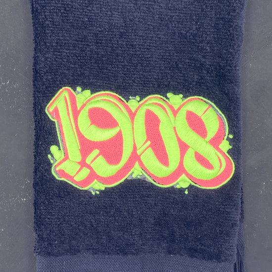 Detail of 1908 black velour Leisure Luxe Towel. 