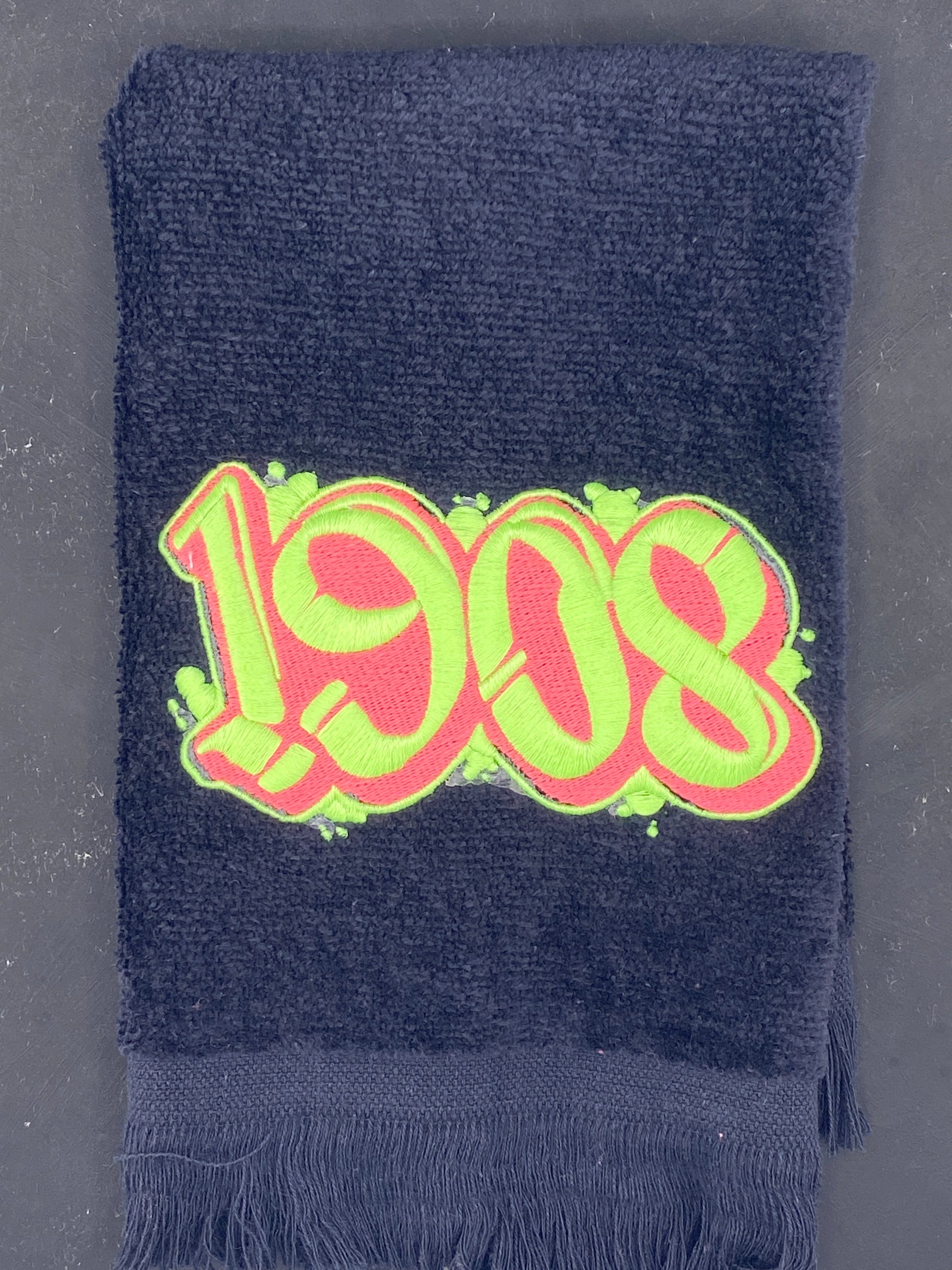 Detail of 1908 black velour Leisure Luxe Towel. 