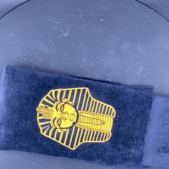 Old Gold Alpha Phi Alpha Sphinx Stroll Towel in slow motion