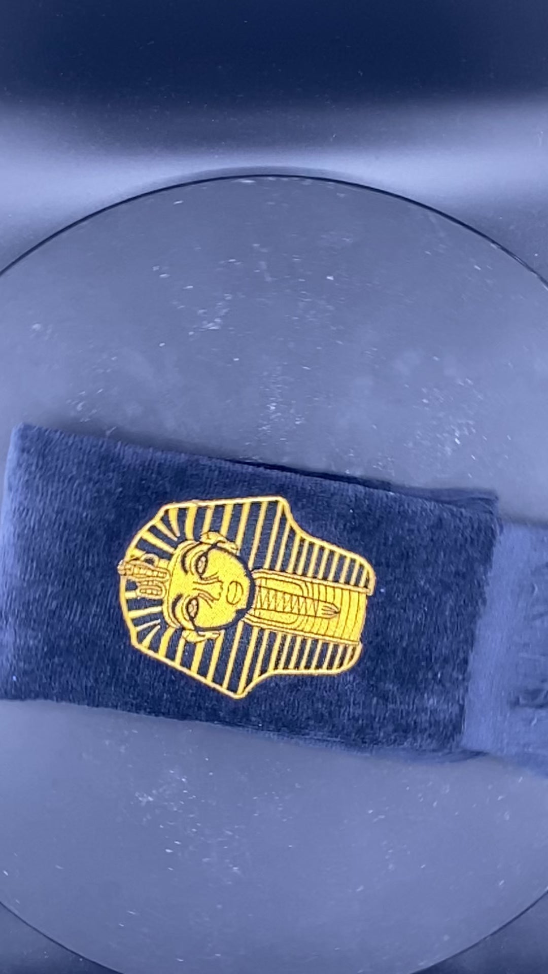 Old Gold Alpha Phi Alpha Sphinx Stroll Towel in slow motion