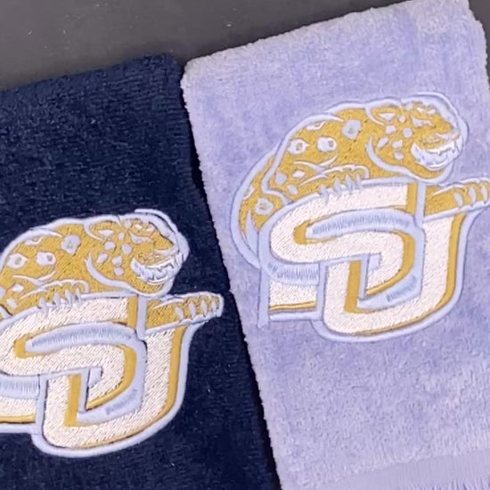 2 velour Leisure Luxe Towel  towel with Southern University Jaguar embroidered in satin gold and light blue. 