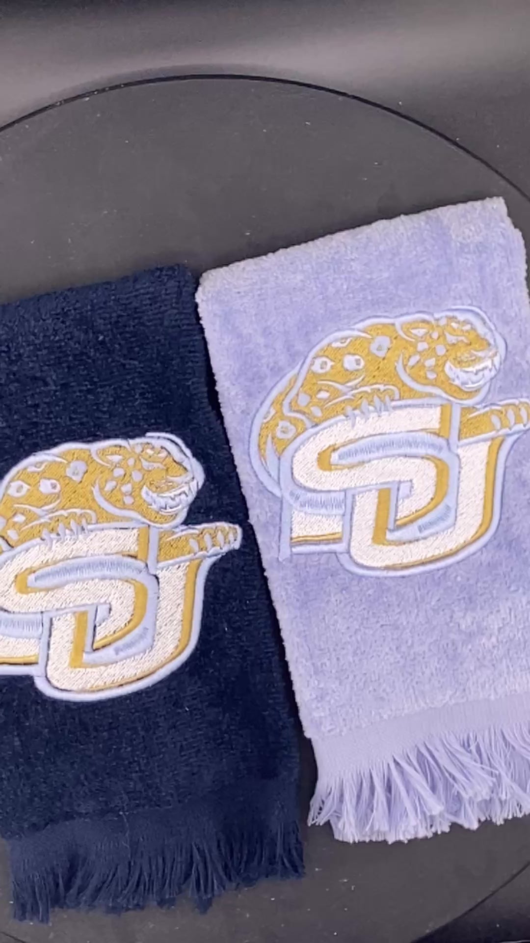 2 velour Leisure Luxe Towel  towel with Southern University Jaguar embroidered in satin gold and light blue. 