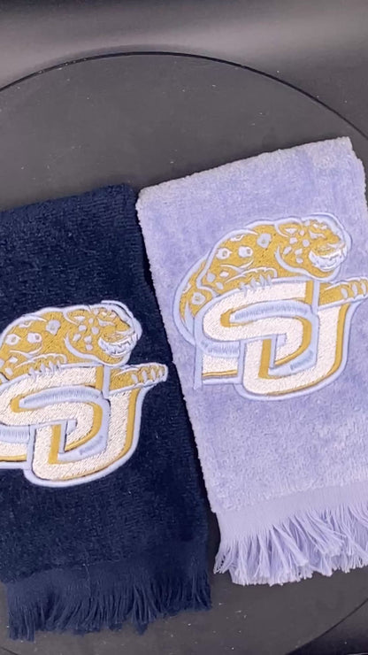 2 velour Leisure Luxe Towel  towel with Southern University Jaguar embroidered in satin gold and light blue. 